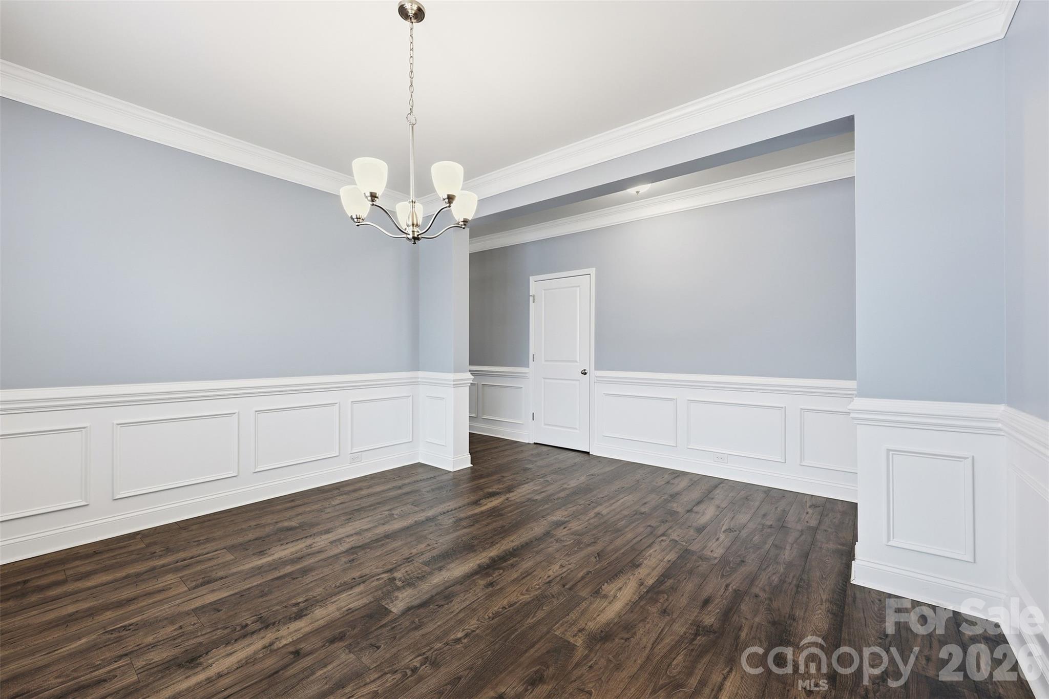 2314 Red Birch Way Concord, NC 28027 - Photo 11 of 44 a view of an empty room with wooden floor