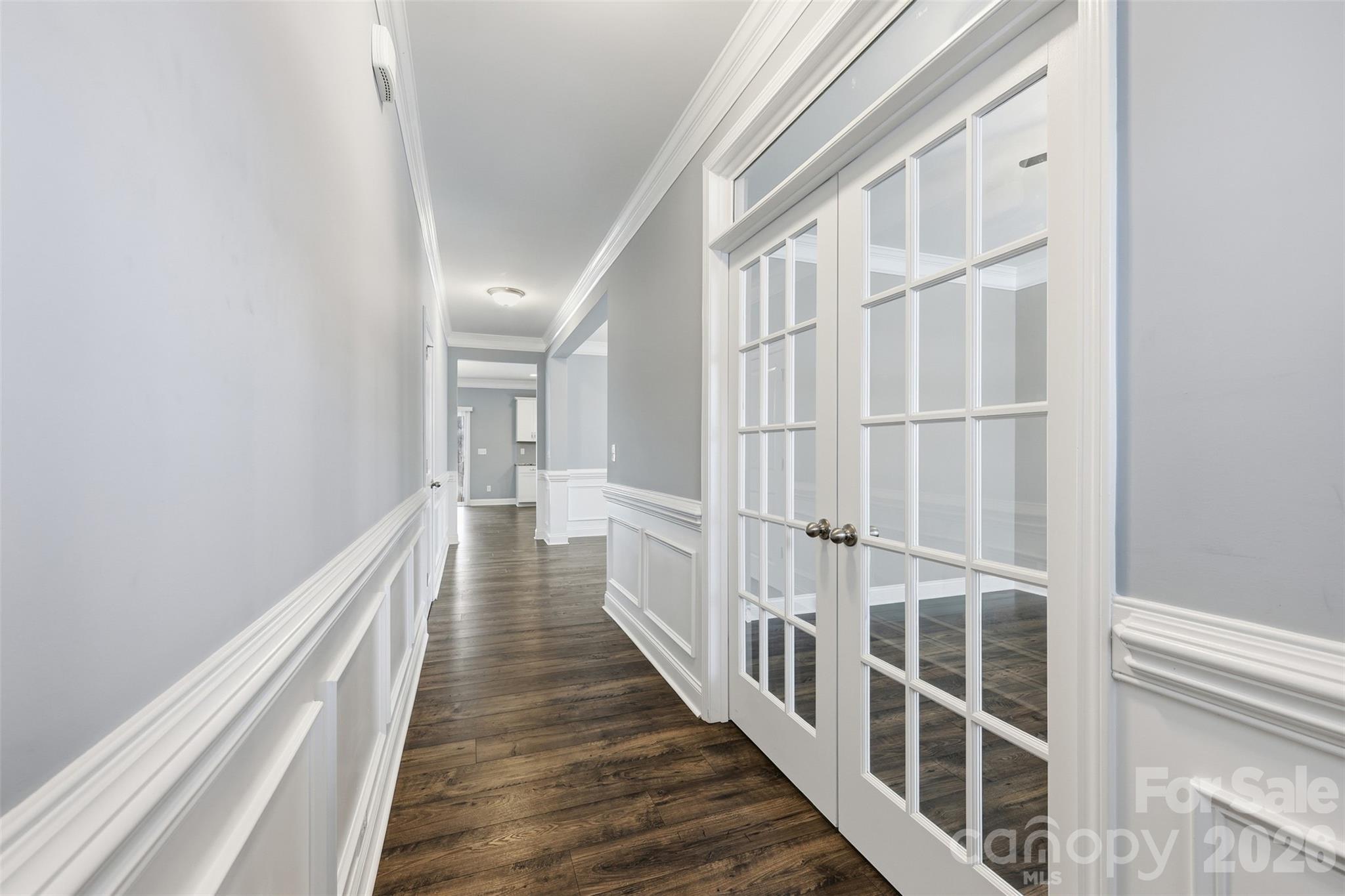 2314 Red Birch Way Concord, NC 28027 - Photo 13 of 44 a view of a hallway with wooden floor and staircase