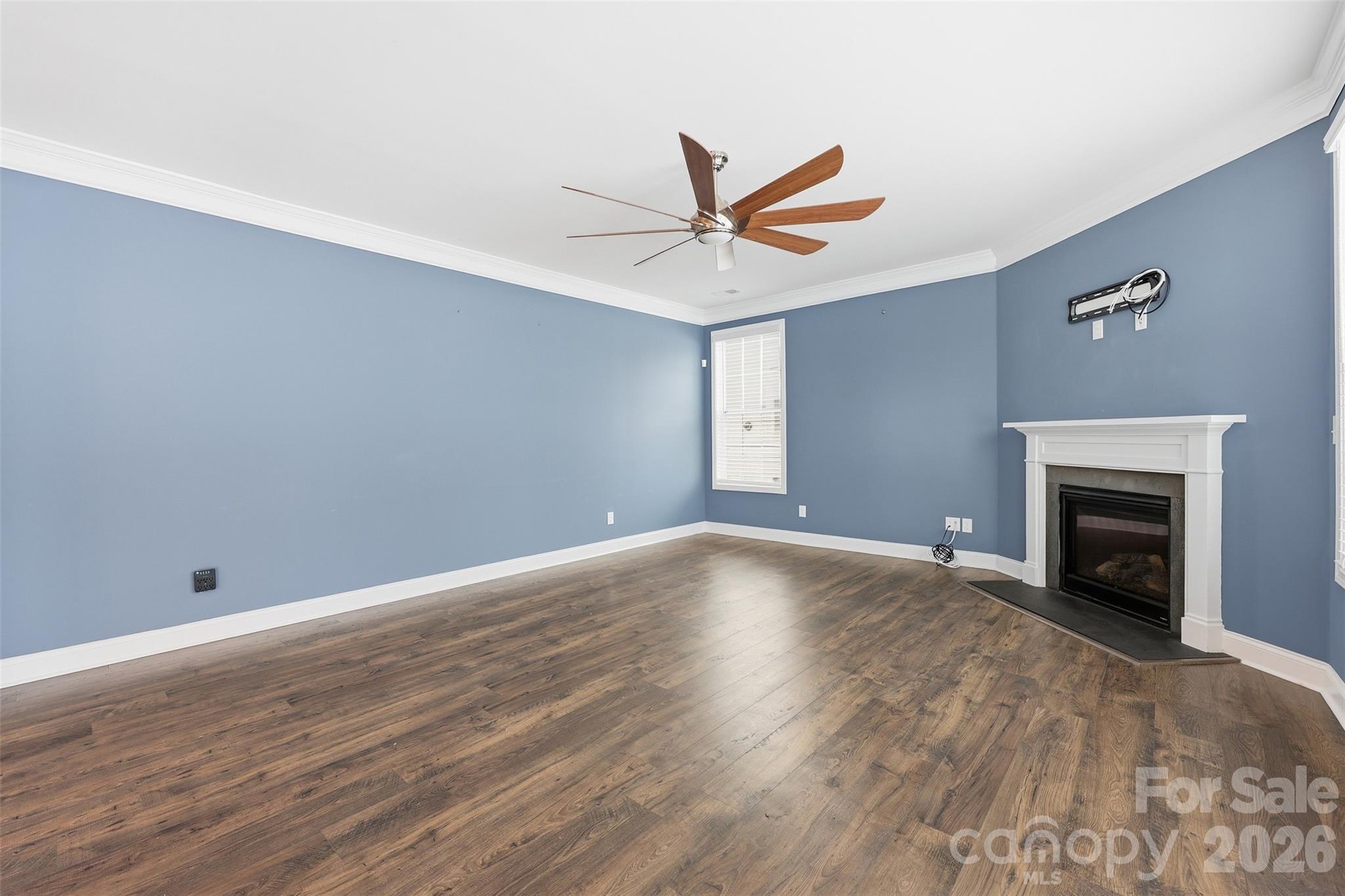 2314 Red Birch Way Concord, NC 28027 - Photo 21 of 44 wooden floor in an empty room with a fireplace