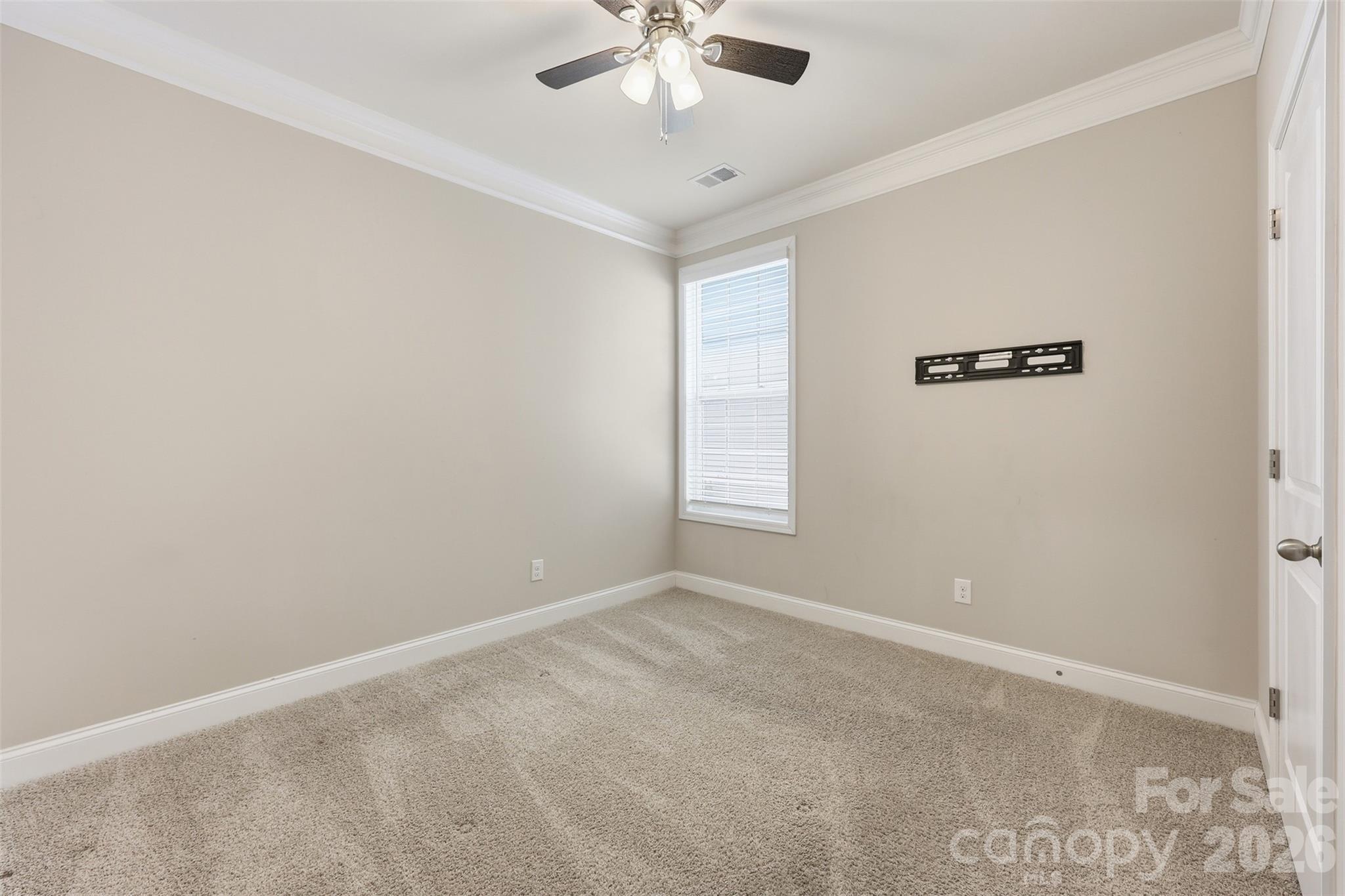 2314 Red Birch Way Concord, NC 28027 - Photo 23 of 44 an empty room with a window and a fan