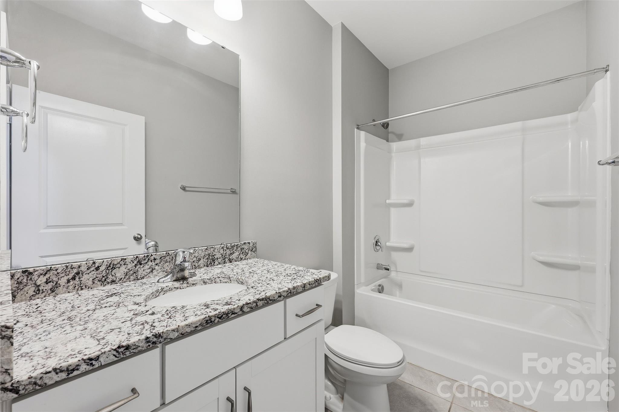 2314 Red Birch Way Concord, NC 28027 - Photo 38 of 44 a bathroom with a granite countertop sink toilet and shower