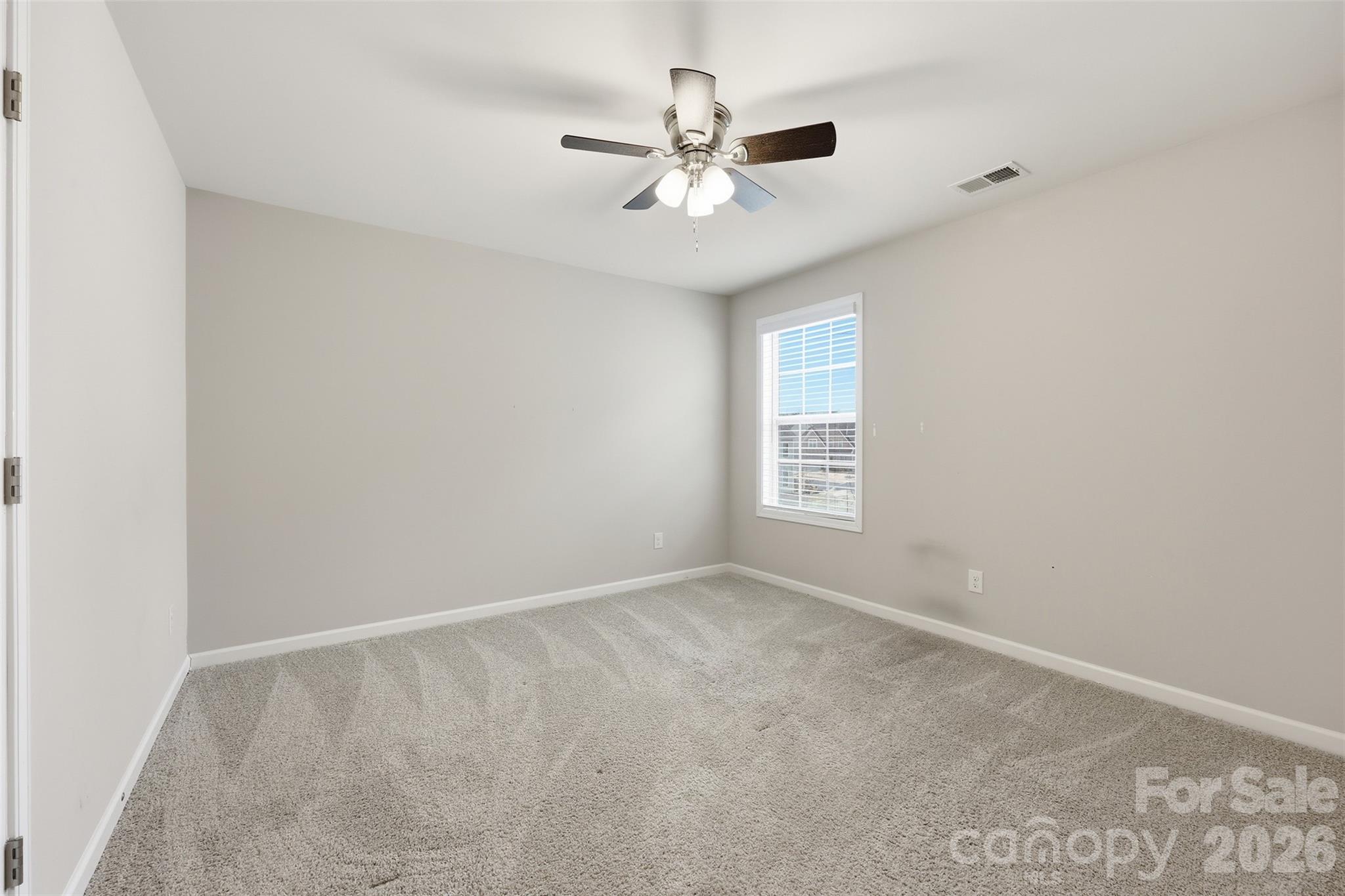 2314 Red Birch Way Concord, NC 28027 - Photo 41 of 44 a view of an empty room with a window