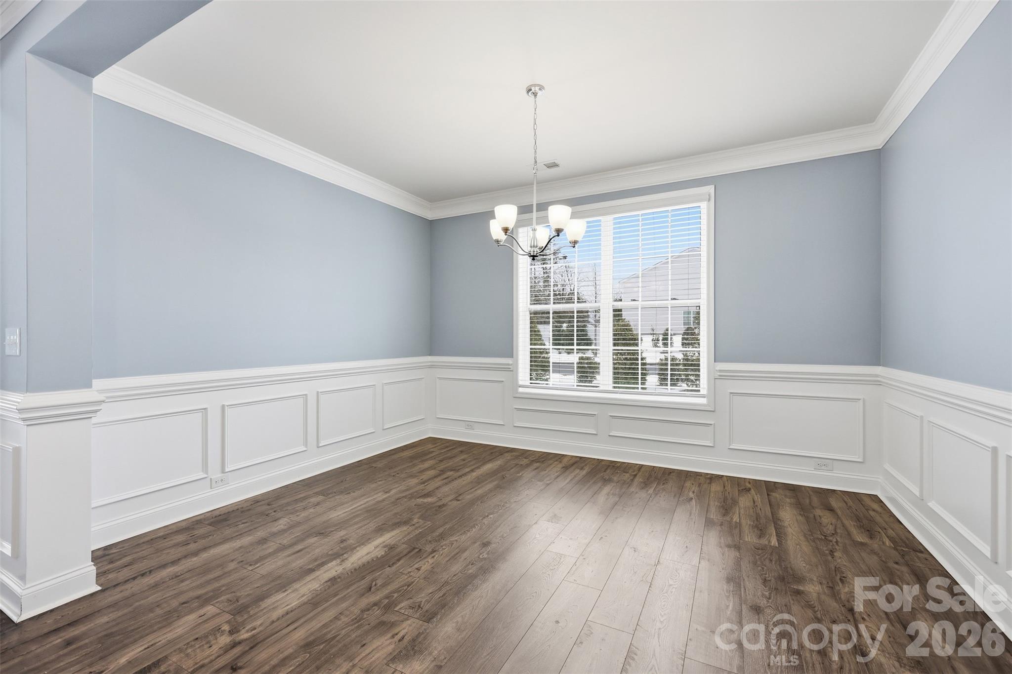 2314 Red Birch Way Concord, NC 28027 - Photo 10 of 44 a view of an empty room with wooden floor and a window