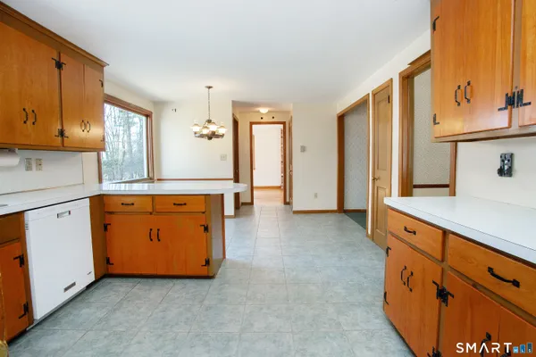 a view of a kitchen with cabinets