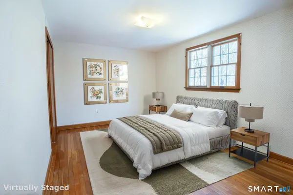 a bedroom with a bed and a couch