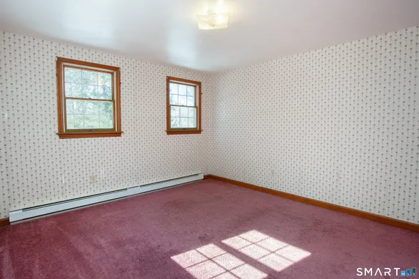 an empty room with windows