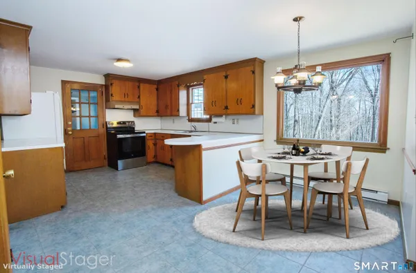 a view of a dining room with furniture window and outside view