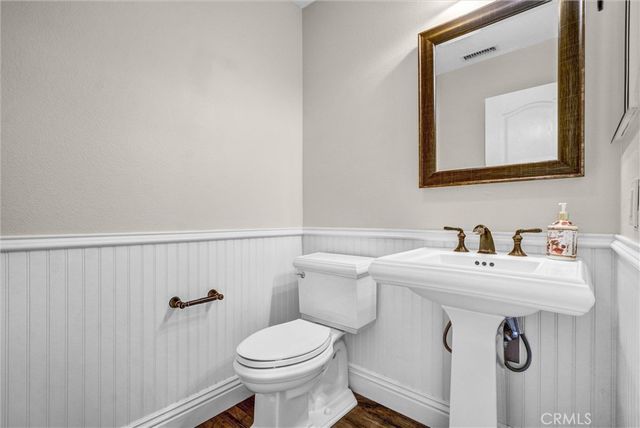 a view of entryway with furniture and wooden floor