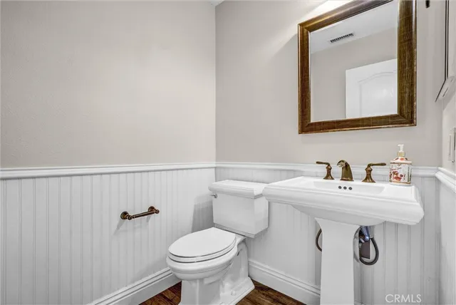 a view of entryway with furniture and wooden floor