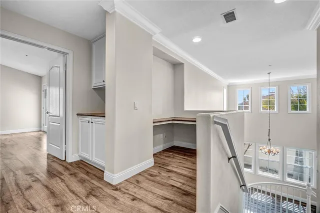 a view of a room with wooden floor