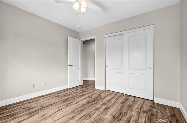 a bedroom with bed and a window