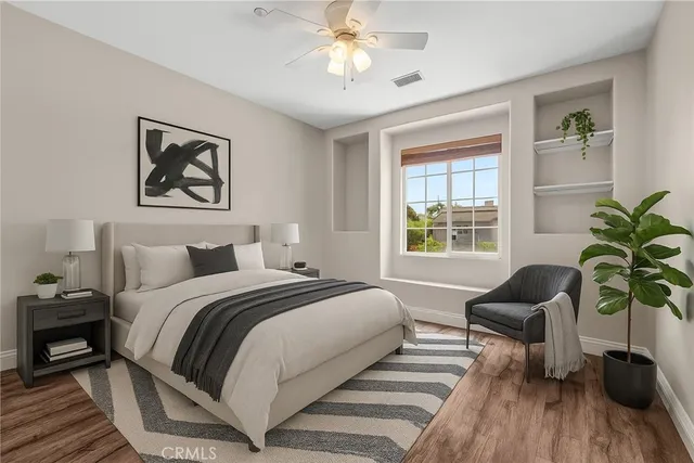 a bedroom with a large bed and a window