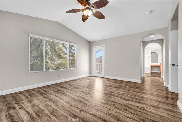 a view of a hallway view with large mirror and a shower