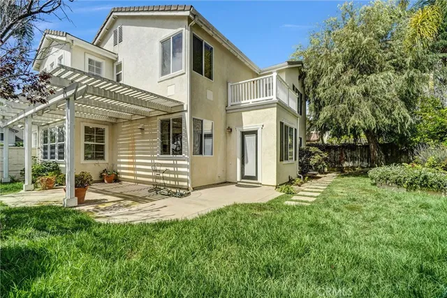a view of a backyard with sitting area