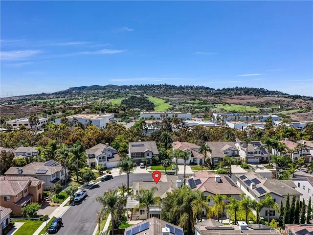 a view of a city with mountains in the background