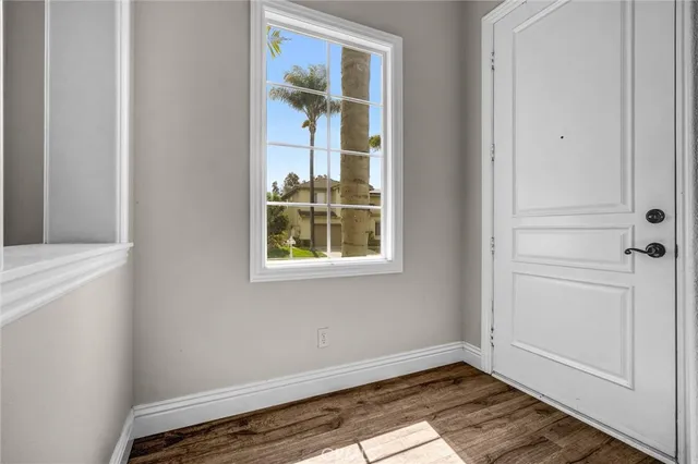 a kitchen with granite countertop a sink stove and refrigerator