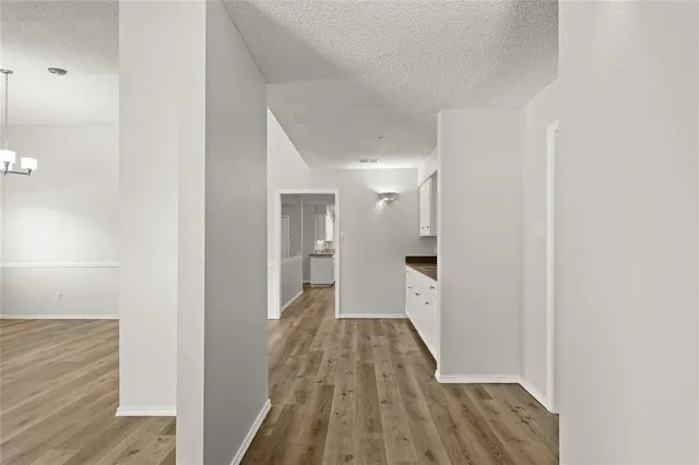 a view of a bathroom with wooden floor