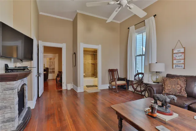 a living room with furniture fireplace and flat screen tv