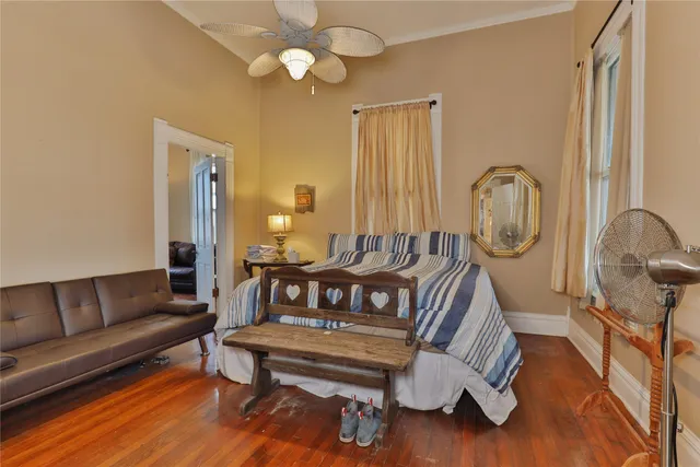 a living room with furniture rug and wooden floor