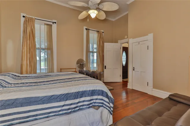 a bedroom with a bed and a chandelier