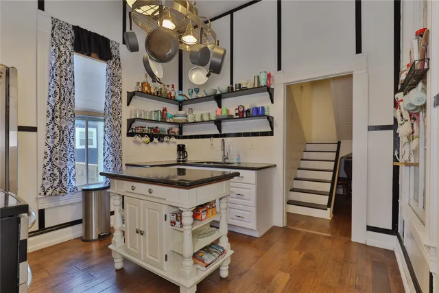 a kitchen with stainless steel appliances granite countertop a stove and a refrigerator