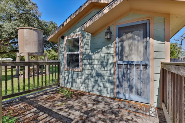 wooden floor living room with furniture and windows