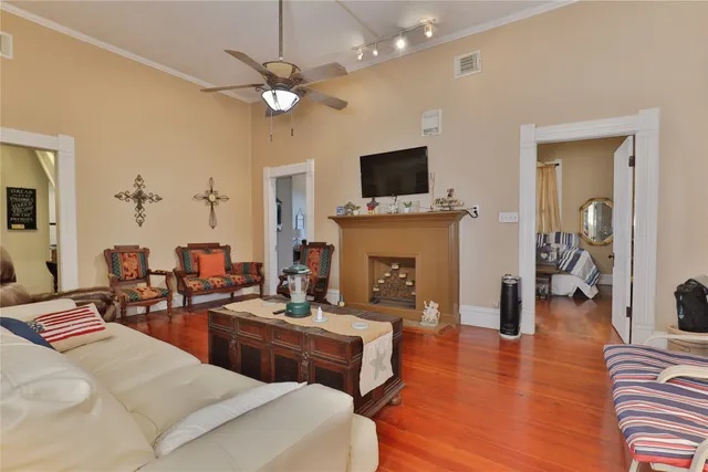 a living room with fireplace furniture and a flat screen tv