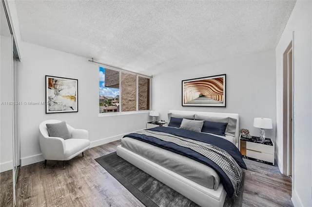 a bedroom with bed and a couch