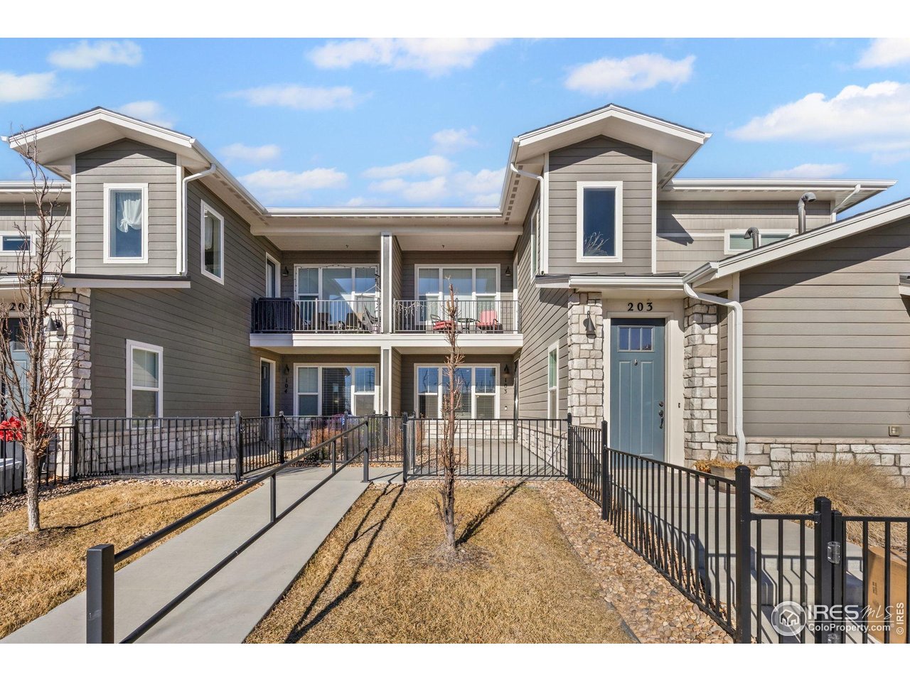 330 High Point Drive, Unit B103 Longmont, CO 80504 - Photo 1 of 18 a view of a house with wooden deck