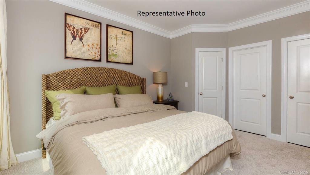 3377 Friendship Street Indian Land, SC 29707 - Photo 20 of 44 a bedroom with a bed and painting on the wall
