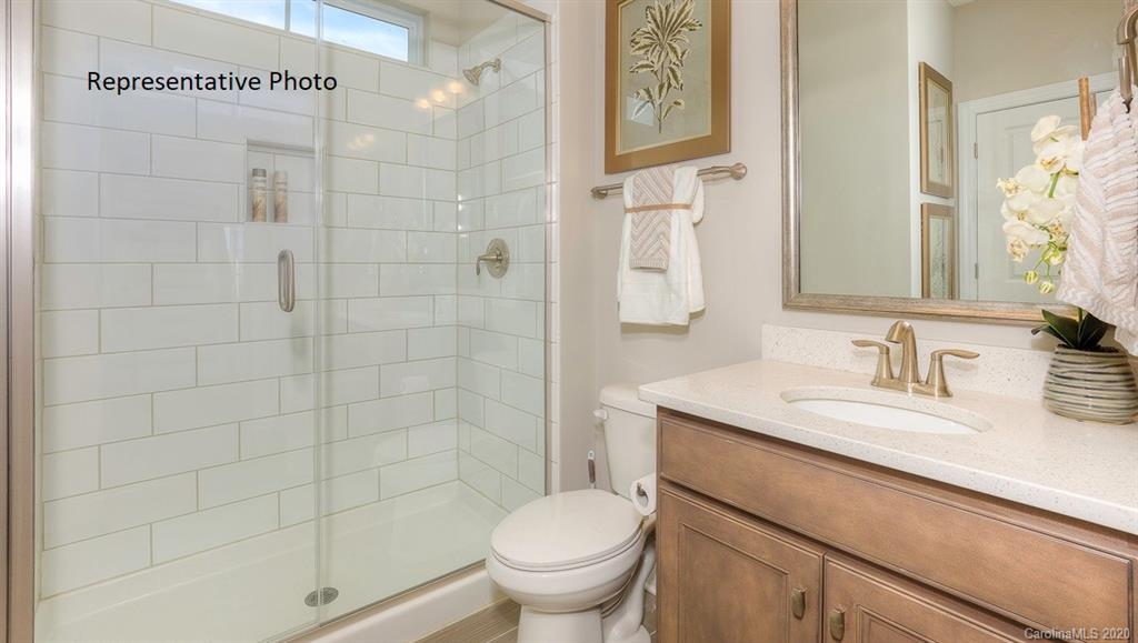 3377 Friendship Street Indian Land, SC 29707 - Photo 21 of 44 a bathroom with a granite countertop toilet sink and shower