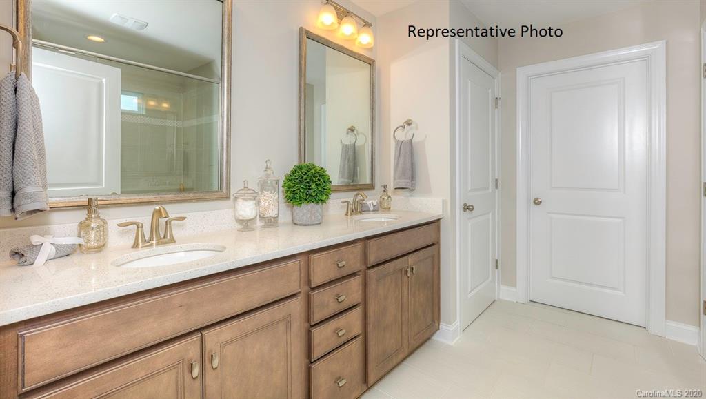 3377 Friendship Street Indian Land, SC 29707 - Photo 27 of 44 a bathroom with a double vanity sink and mirror