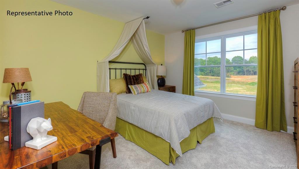 3377 Friendship Street Indian Land, SC 29707 - Photo 33 of 44 a bedroom with a bed and a window