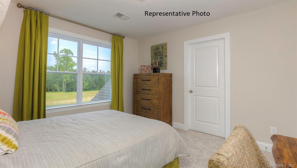 3377 Friendship Street Indian Land, SC 29707 - Photo 35 of 44 a bedroom with a bed and a window