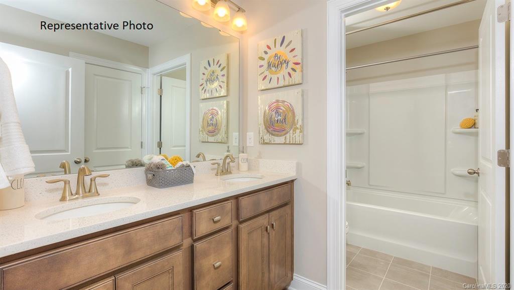 3377 Friendship Street Indian Land, SC 29707 - Photo 39 of 44 a bathroom with a granite countertop sink and a mirror
