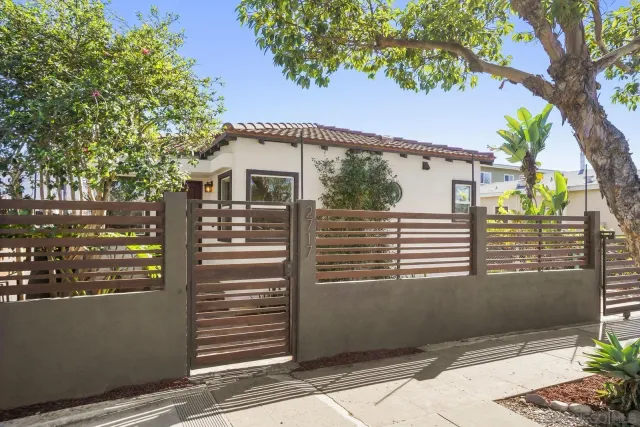 a view of a house with a tree