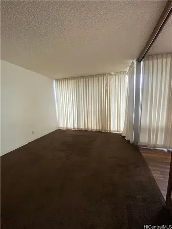 an empty room with a empty space and a window