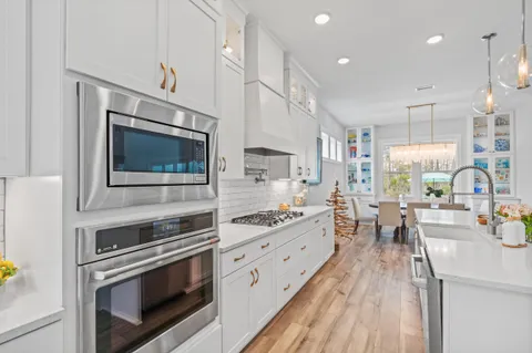 a view of a dining room with furniture and window