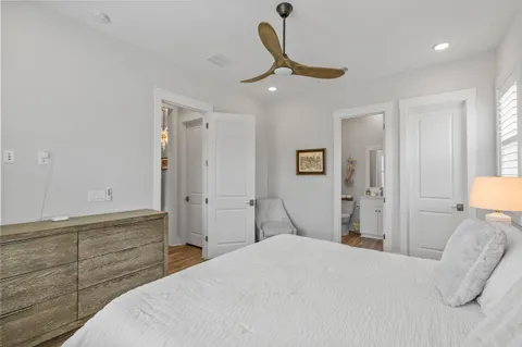 a bed room with a bed and a chair