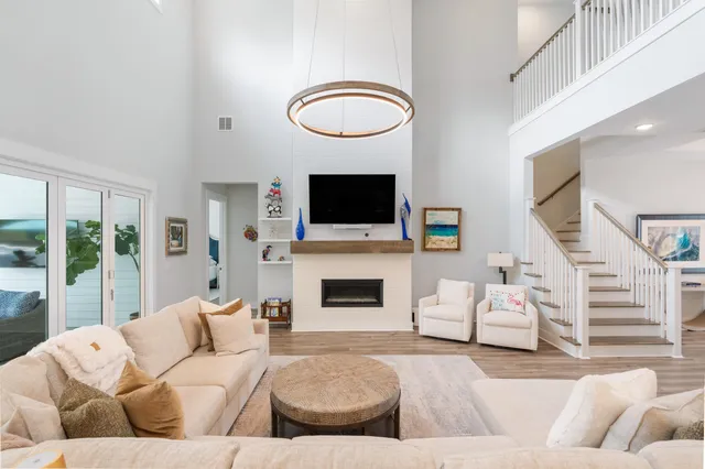 a living room with furniture fireplace and flat screen tv