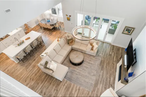 a large kitchen with a table and chairs