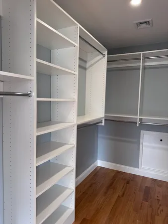 a view of an empty walk in closet