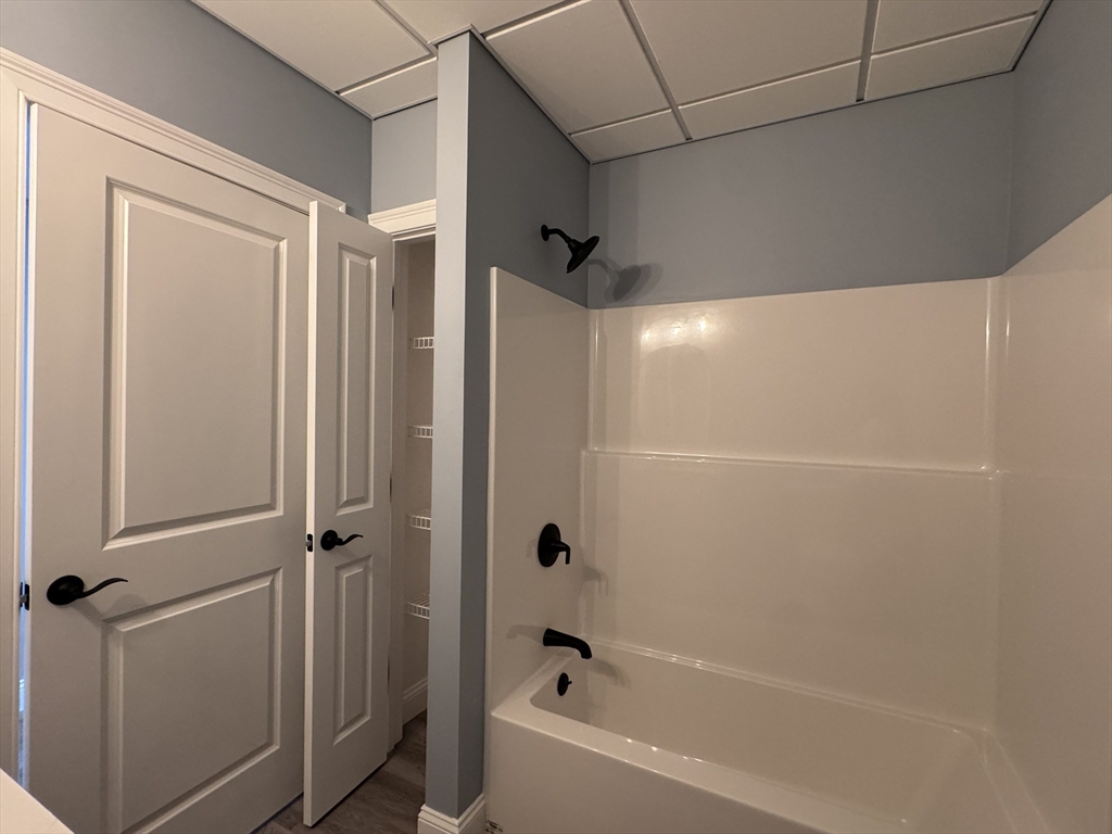 191 East Spring Street Avon, MA 02322 - Photo 24 of 33 a bathroom with a bathtub