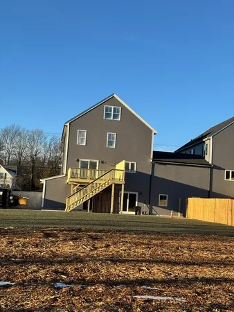 a view of house with a yard