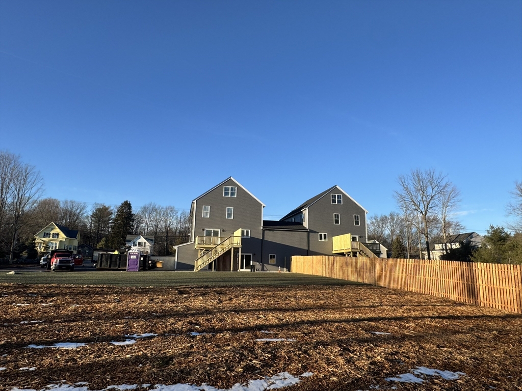 191 East Spring Street Avon, MA 02322 - Photo 32 of 33 a view of house with a yard