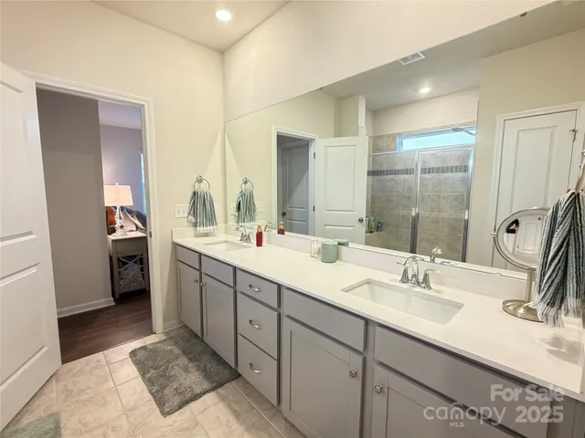 a bathroom with a double vanity sink mirror and double