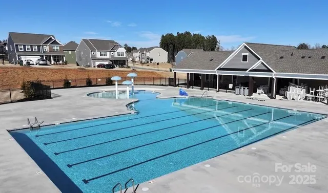 an aerial view of a house with outdoor space