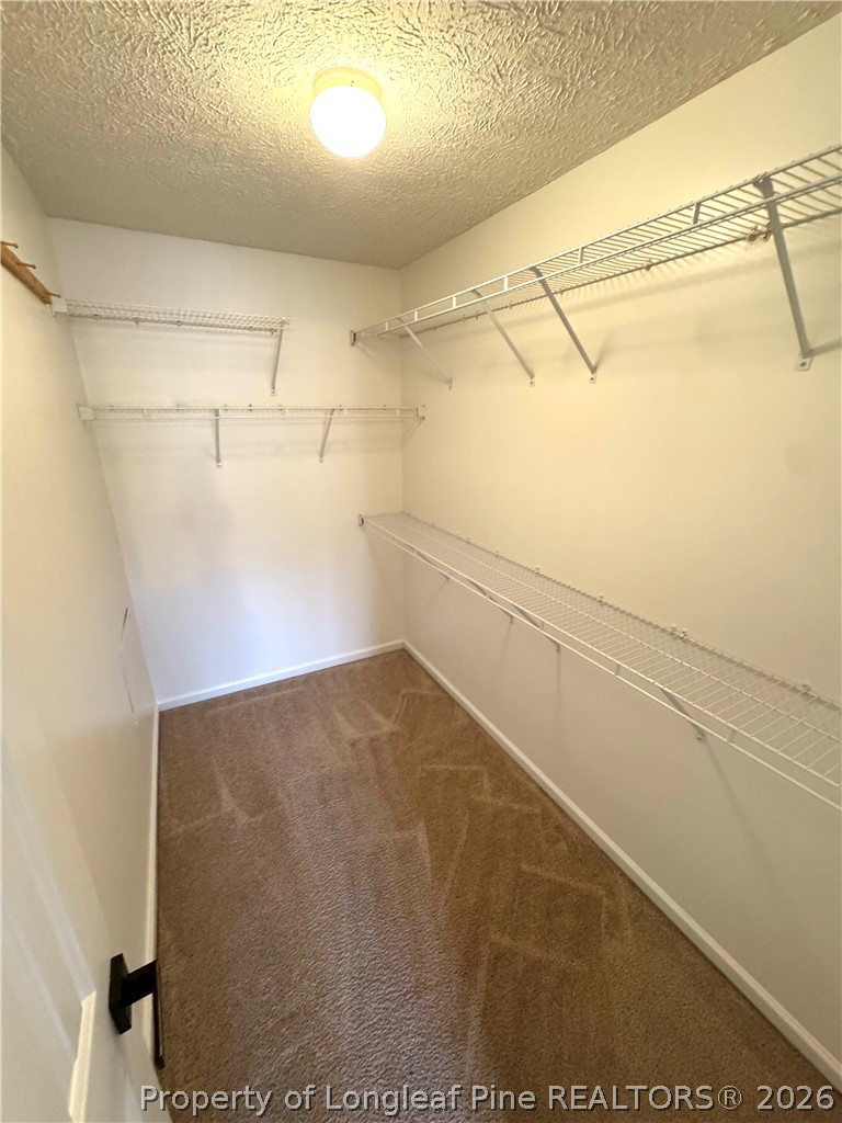 1050 Roundabout Road Cameron, NC 28326 - Photo 13 of 20 a view of a room with racks on the wall