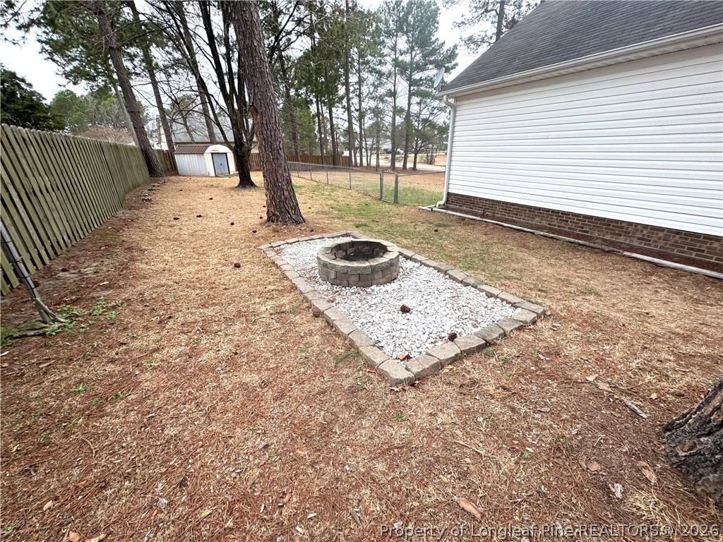 1050 Roundabout Road Cameron, NC 28326 - Photo 17 of 20 a view of a yard with trees