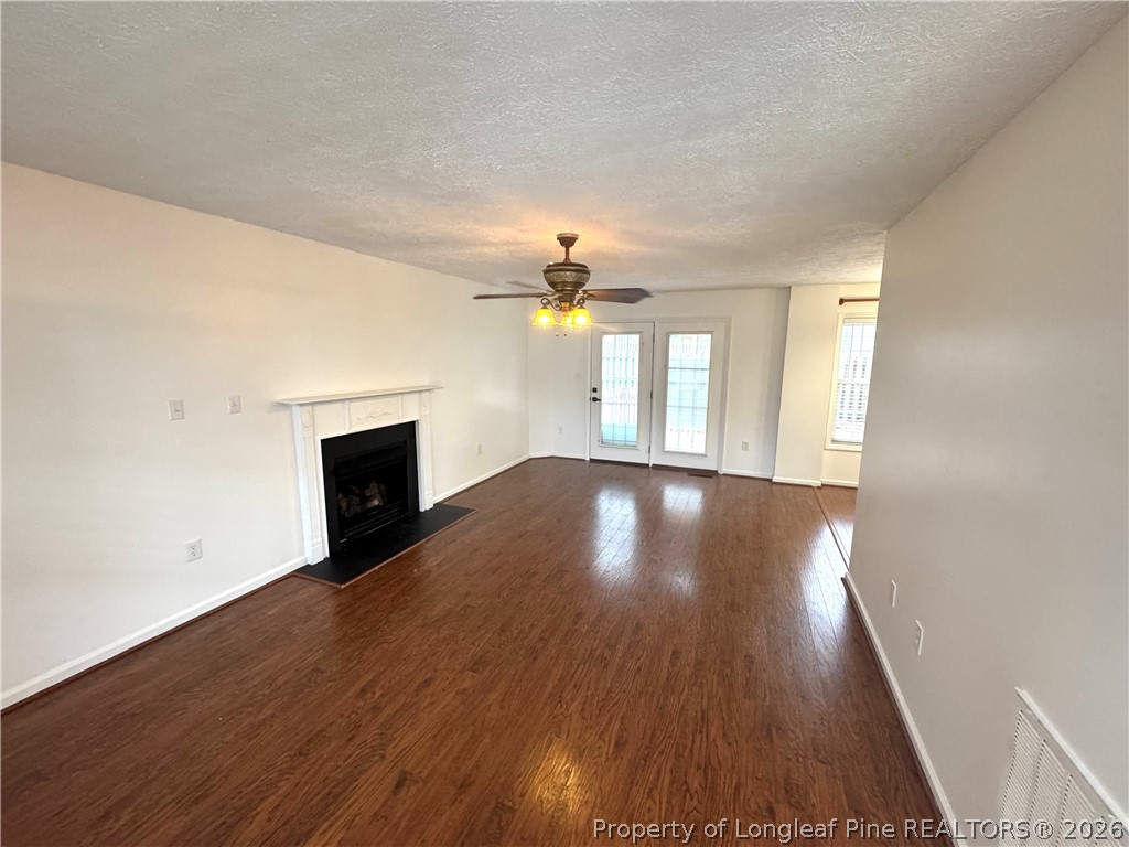 1050 Roundabout Road Cameron, NC 28326 - Photo 2 of 20 wooden floor in an empty room with a window
